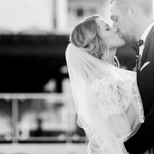 Bride and groom kissing after wedding at NOW Jade Cancun resort