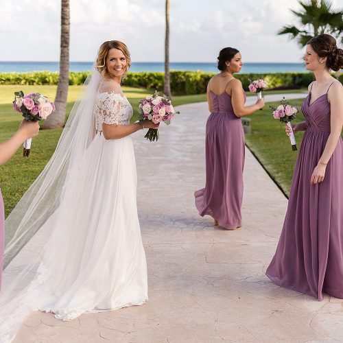 Bride and bridesmaids walking after wedding ceremony