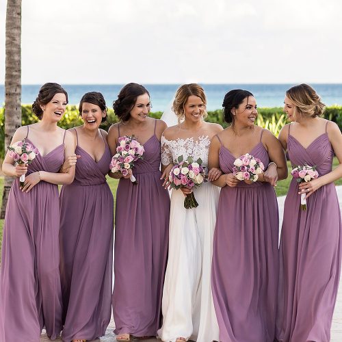 Bridesmaids walking together after wedding.