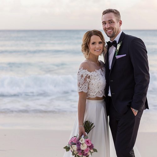 Portrait of bride and groom on the beach at wedding in Cancun