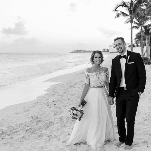 Portrait of bride and groom on beach at wedding in Cancun