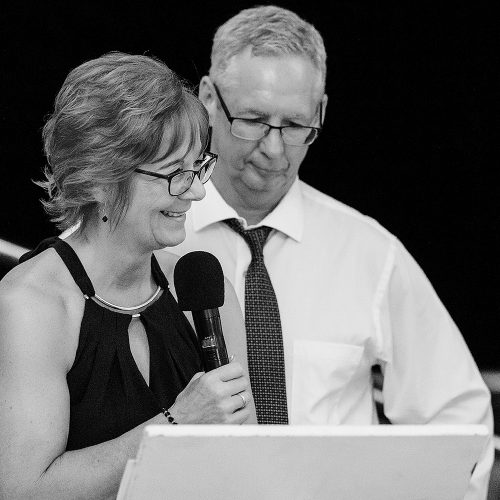 Parents of the bride giving speech at wedding reception
