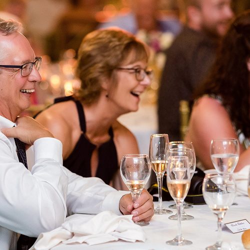 Mother of the bride laughing at wedding reception