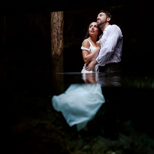 Bride and groom in Cenote Trash the Dress in Mexico
