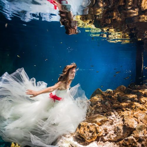 Bride underwater in Trash the Dress shoot in Mexico