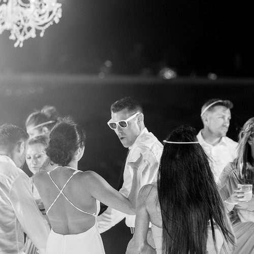 Guests dancing at wedding reception at Secrets on the vine Cancun