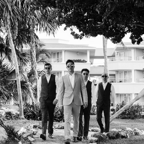 Groomsmen walking at Moon Palace Cancun