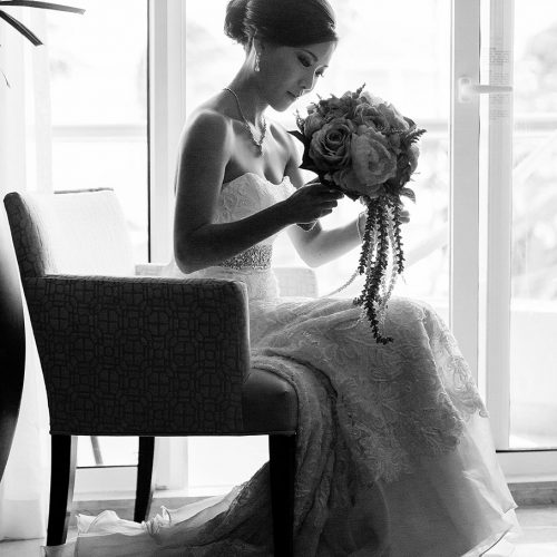 Portrait of bride on chair in room at Moon Palace Cancun wedding