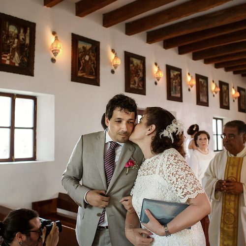Groom and mother at wedding ceremony