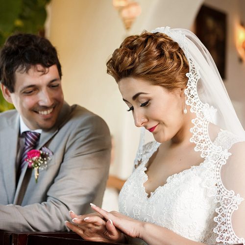 Bride looking at ring at wedding ceremony in Riviera Maya
