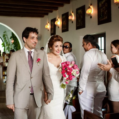 Bride and groom walking after wedding ceremony