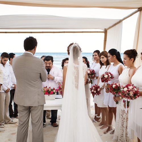 Bride and groom signing documents at wedding in Riviera Maya