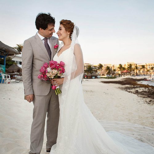 Bride and groom on beach in Riviera Maya