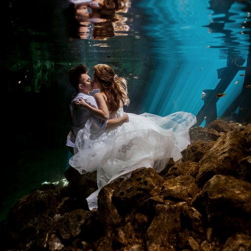 Bride and groom from behind at Cenote Trash the Dress (TTD) in Mexico