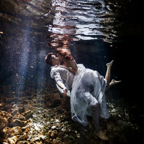 Bride and Groom in Cenote Trash the Dress (TTD) in Mexico