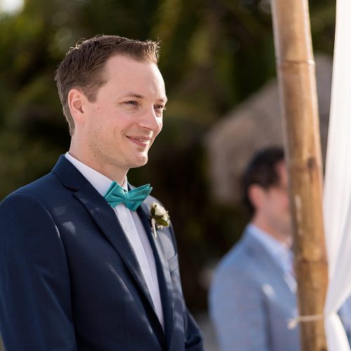 Groom waiting to see bride at wedding ceremony