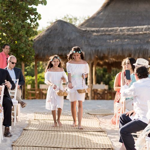 Flower girls on aisle at wedding at Punta Venado, Riviera Maya Mexico