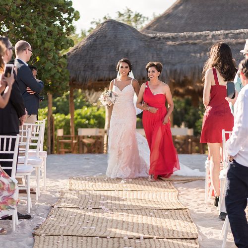 Bride walking down aisle with mother at Punta Venado, Riviera Maya Mexico