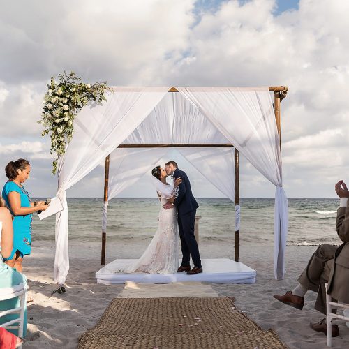 Bride and grooms first kiss during ceremony at Punta Venado, Riviera Maya Mexico