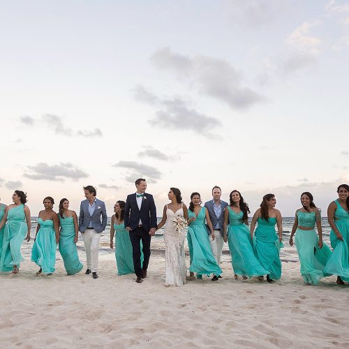 Bridal party walking on beach at Punta Venado, Riviera Maya Mexico