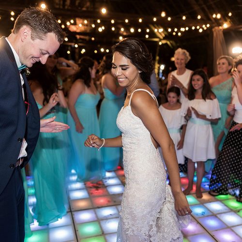Bride and grooms dancing at wedding reception.