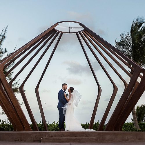 Bride and groom in gazebo at Azul Fives Riviera Maya