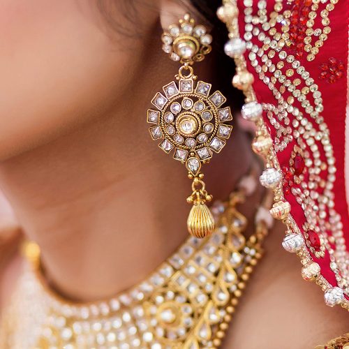 Close up of Indian brides ear ring at wedding
