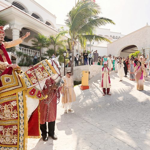 Baraat wedding ceremony with groom on horse in Cancun