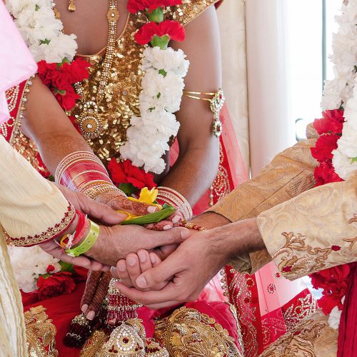 Close up of hands during Indian wedding ceremony