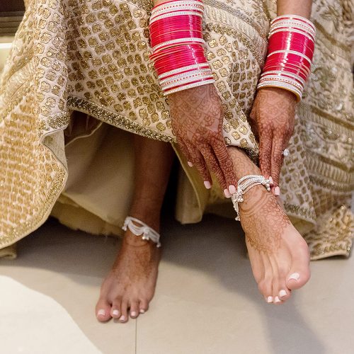 Close up of bride's feet at getting ready for wedding reception