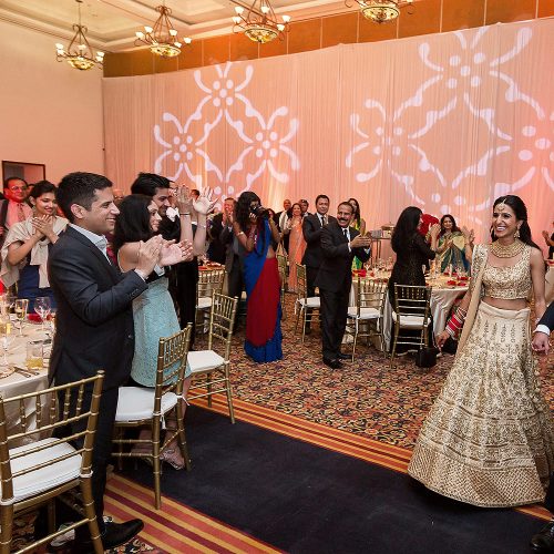 Bride and groom arriving to Indian wedding reception in Cancun