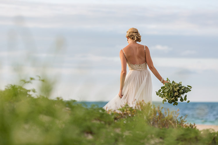 Bride on beach in Cancun