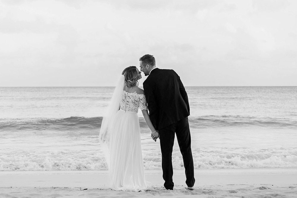 Bride and Groom about to kiss on beach in Cancun, NOW Jade resort