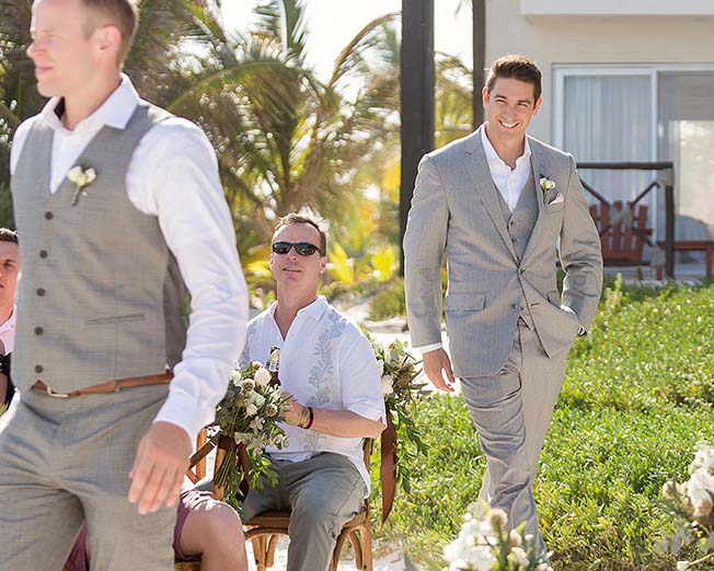 Groom walking down Aisle in Tulum on beach