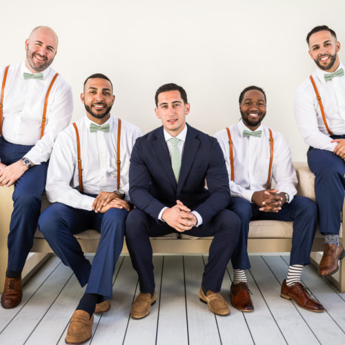 Groomsmen on bench at Finest Playa Mujeres