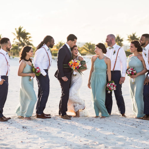 Bridal party having fun on beach at Finest Playa Mujeres