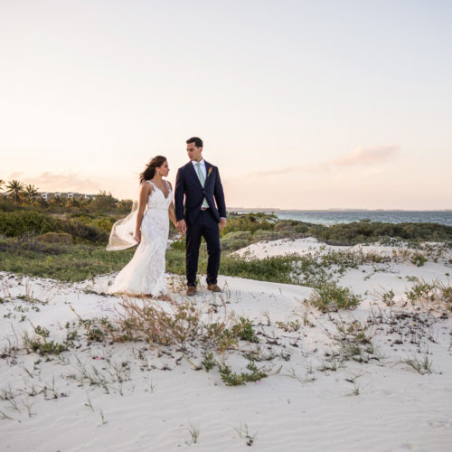 Bride and groom on sand dune at Finest Playa Mujeres