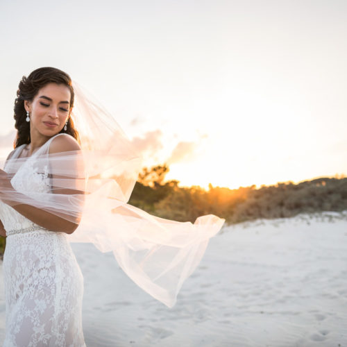 Portrait of bride with sunset behind.