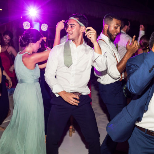 Groom dancing at wedding reception