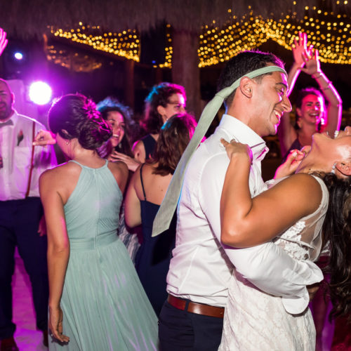 Guests dancing at wedding reception.