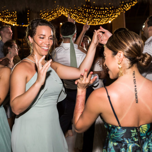 Guests dancing at wedding reception.