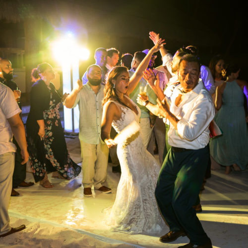 Guests dancing at wedding reception at Finest Playa Mujeres.