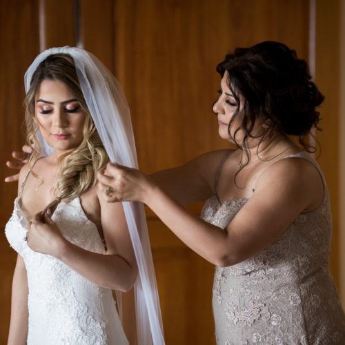 Mother helping bride dress at NOW Sapphire Riviera Maya Resort