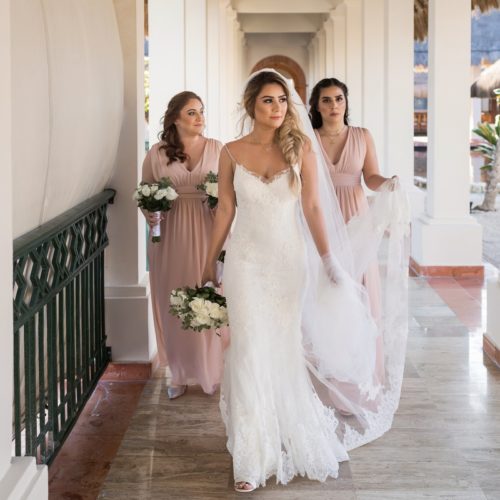 Bridesmaids walking in hall at NOW Sapphire Riviera Maya Resort