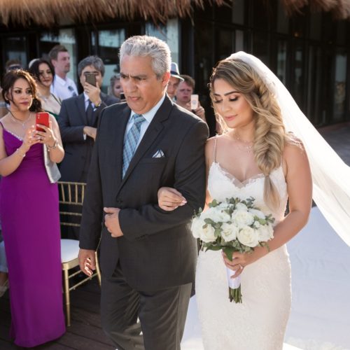 Bride walking down the aisle with father on tequila terrace NOW Sapphire Riviera Maya Resort