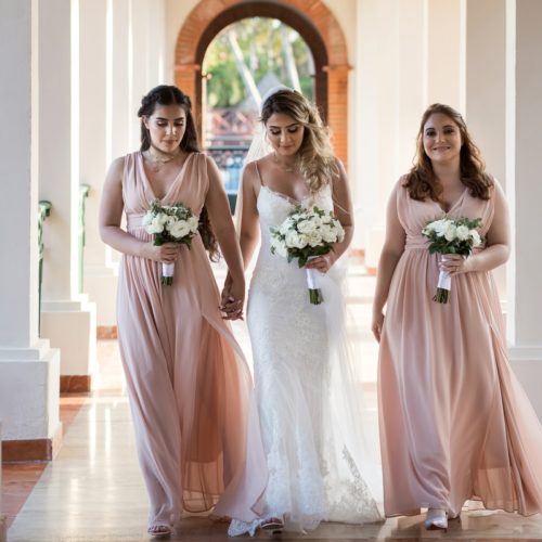 Bridesmaids walking hallway at NOW Sapphire Riviera Maya Resort