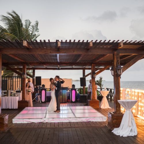 Bride and grooms first dance on tequila terrace at Bride in gardens at NOW Sapphire Riviera Maya Resort