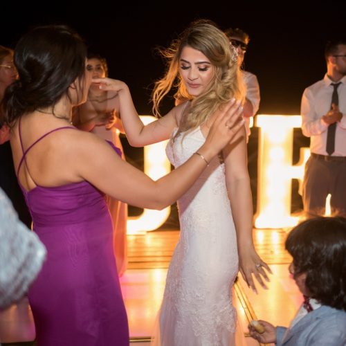 Bride dancing with guests on tequila terrace, Bride in gardens at NOW Sapphire Riviera Maya Resort