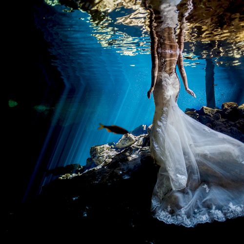 Bridal dress underwater in Mexican cenote.