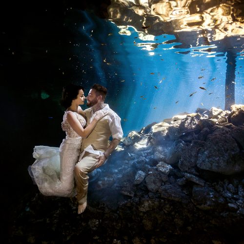 Bride and groom in underwater TTD in Mexican Cenote
